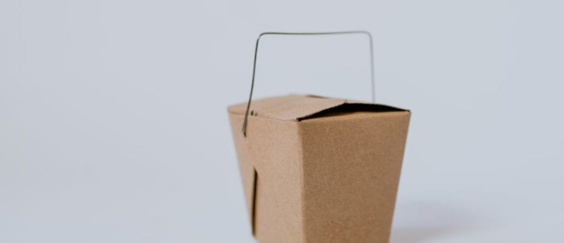 Photo by Kelly Sikkema small brown cardboard box with handle