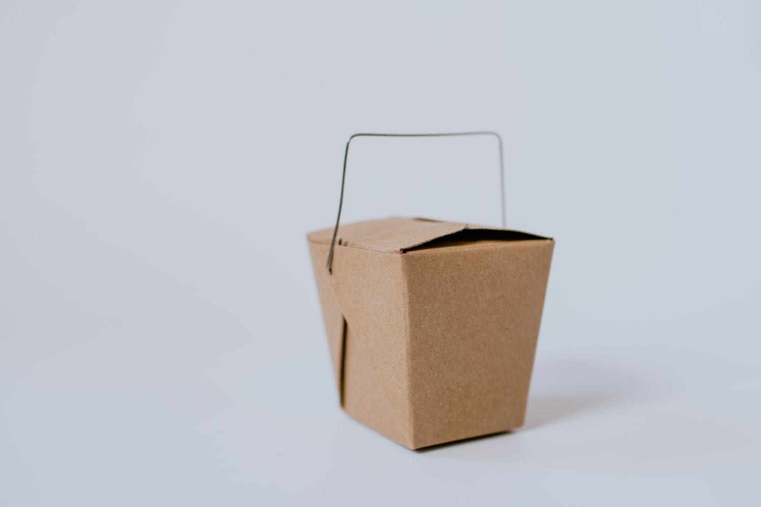 Photo by Kelly Sikkema small brown cardboard box with handle